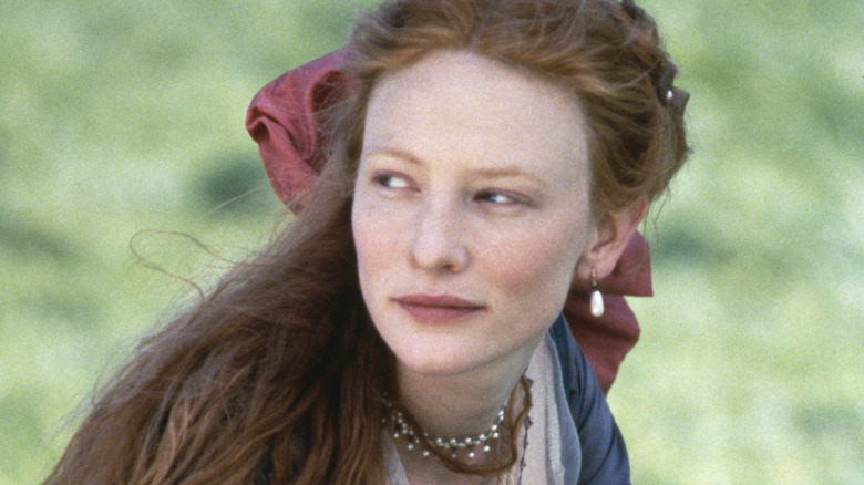 Cate Blanchett smiling outdoors in Elizabethan costume