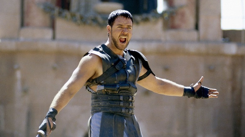 Russell Crowe in "Gladiator" in costume yelling arms raised