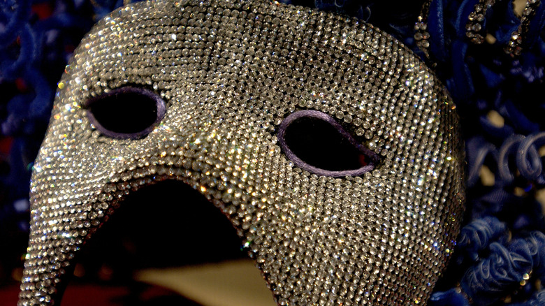Close-up of sequined opera mask