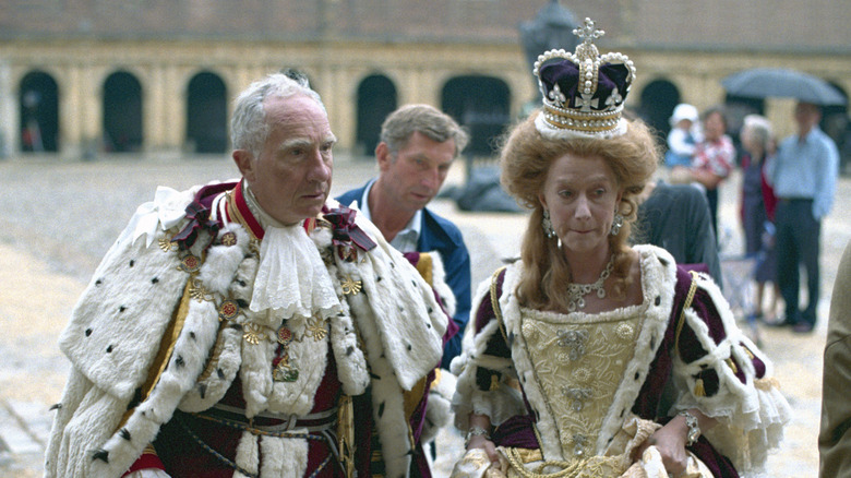Actors dressed as King George and Queen with royal finery and crown