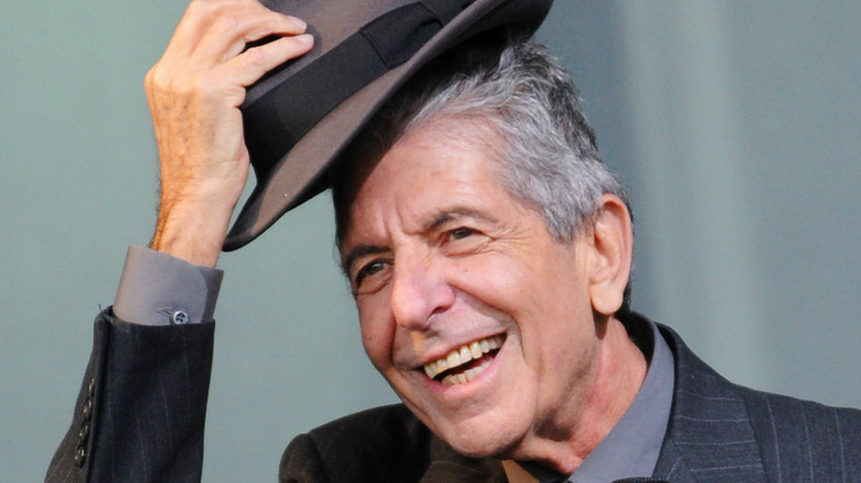 Leonard Cohen doffing hat