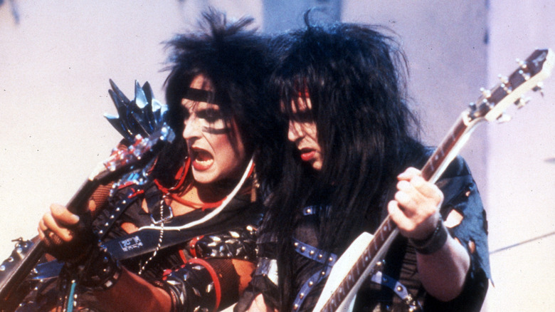 Nikki Sixx and Mick Mars of Motley Crüe on stage in the 1980s