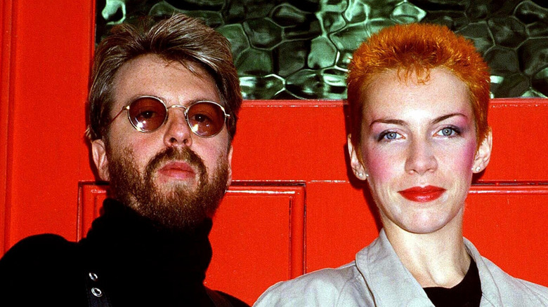 Eurythmics in front of a red door