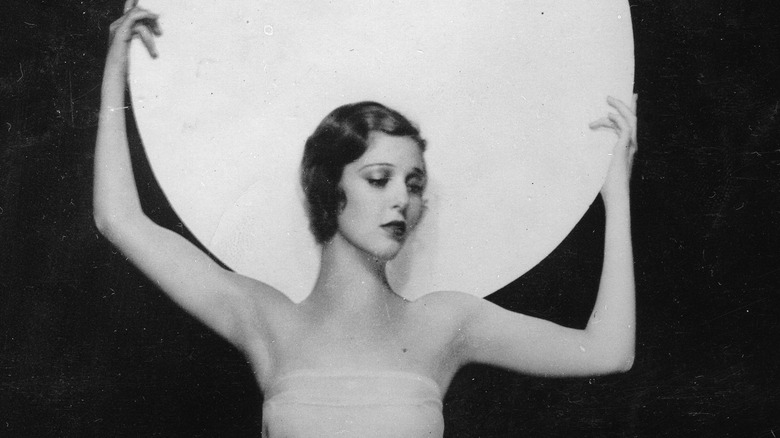 Actress Loretta Young dancing white disk