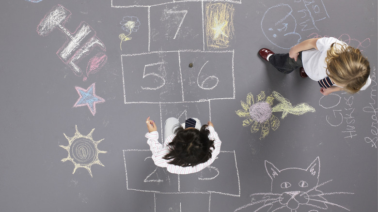 Kids playing hopscotch overhead view