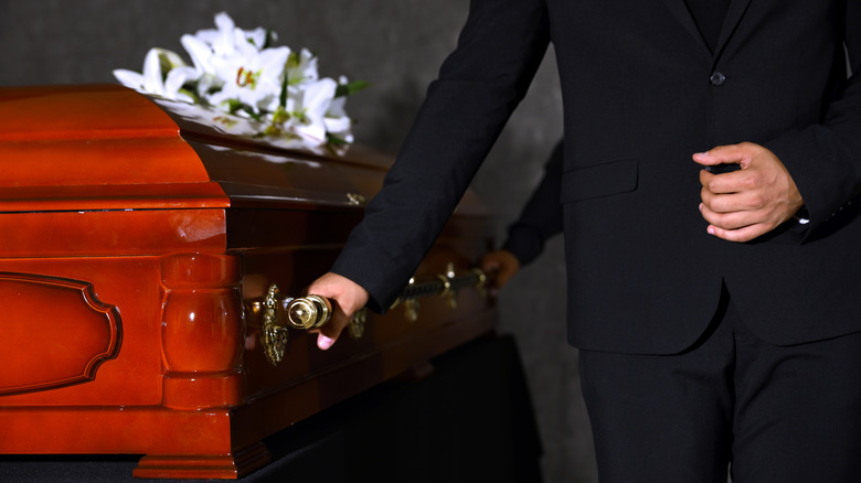 Person carrying a casket