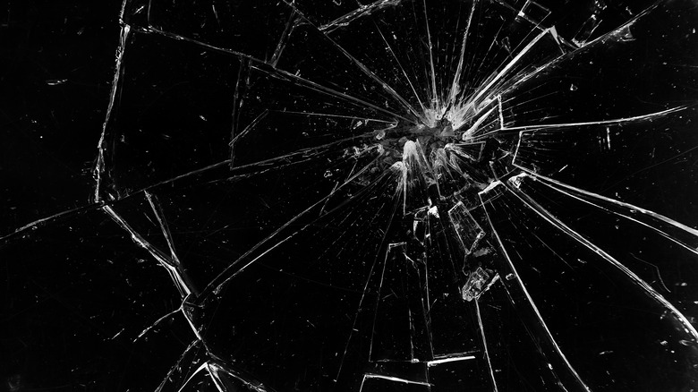 Cracks in glass on black background