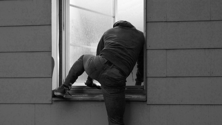 Burglar Entering Through Open Window