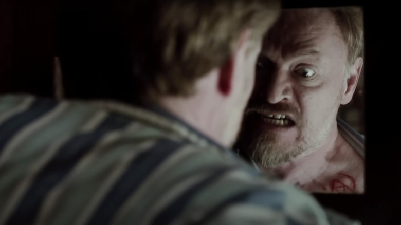 Jared Harris looking in mirror