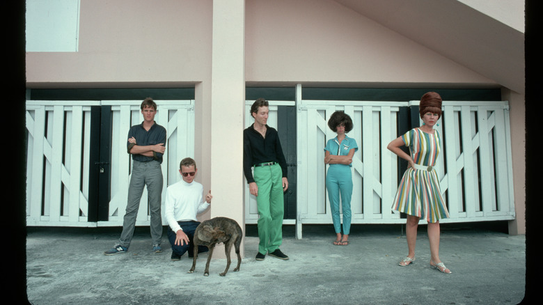 Members of the B-52s pose in front of a building, undated