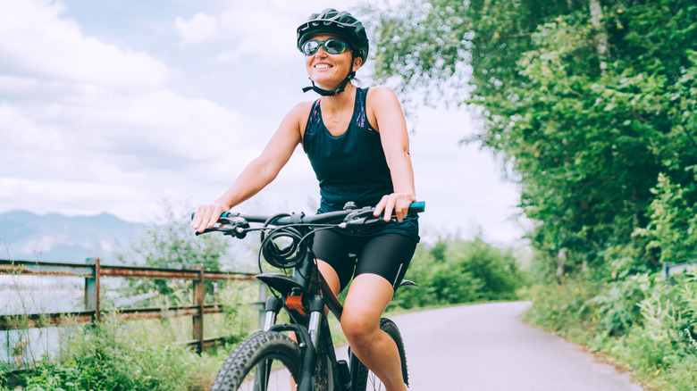 Woman cycling on a path