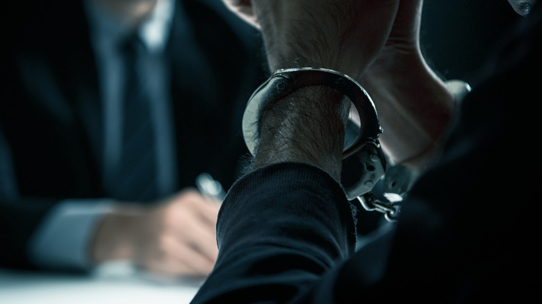 A man wearing handcuffs
