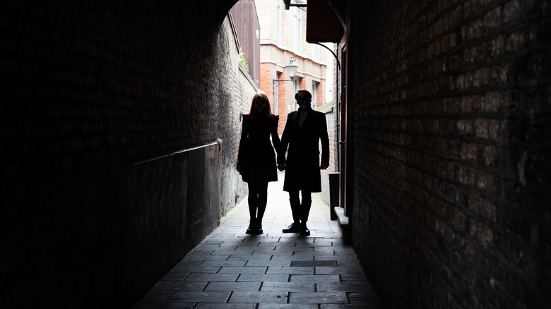 Sinister couple in alley