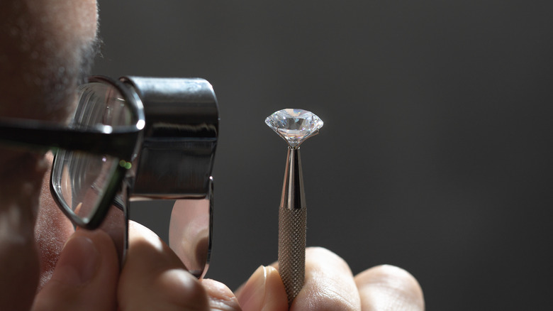 A diamond in tweezers