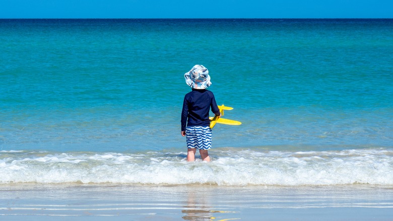 child looking out at water