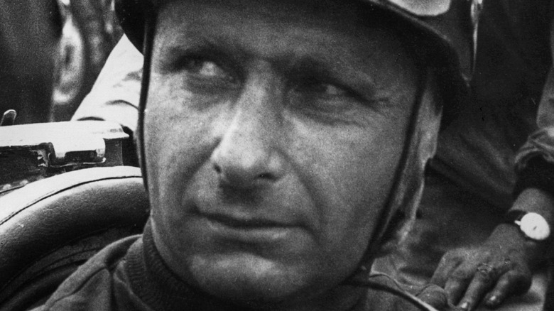 Juan Manuel Fangio looking to side