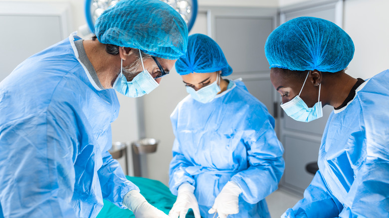 Surgeons performing operation