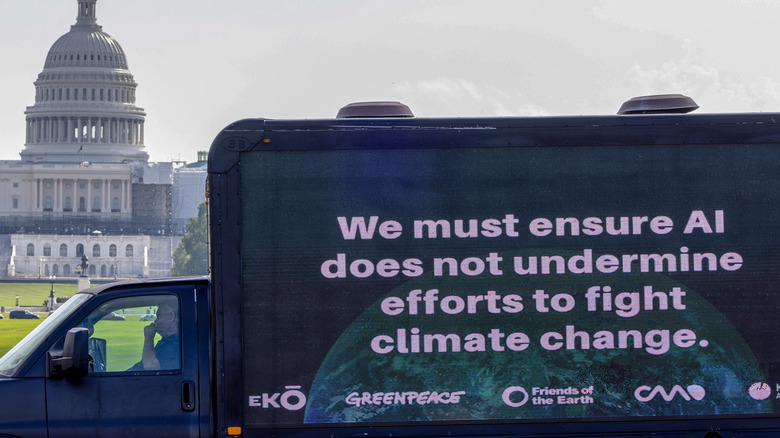 A mobile billboard warning of AI climate disaster in front of the U.S. Capitol