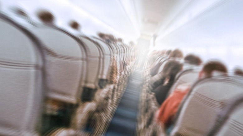 shaky image of airplane aisle