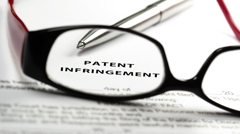 Glasses pen covering patent infringement document