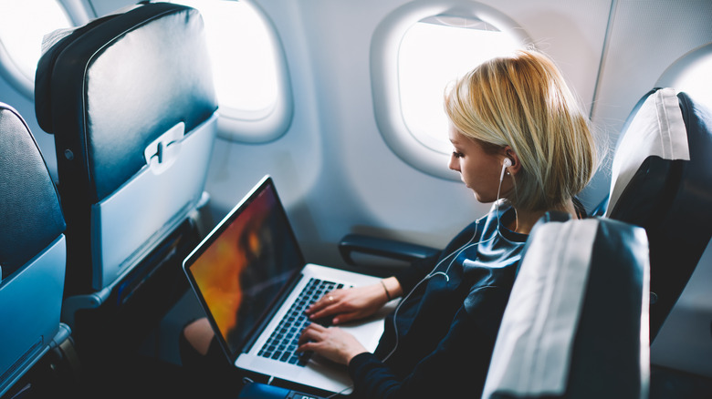 businesswoman on airplane