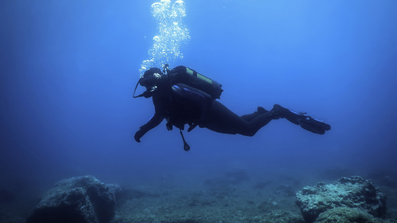 Deep sea diver exploring the sea