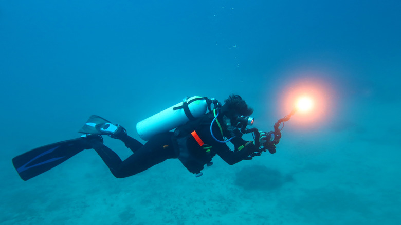 Deep sea diver exploring the sea