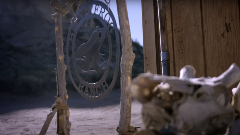 Blind Frog Ranch sign hangs desert