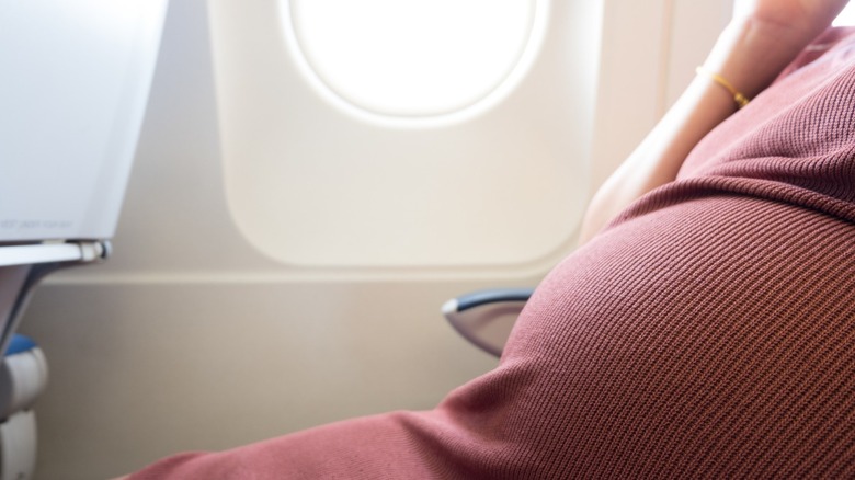 pregnant woman flying