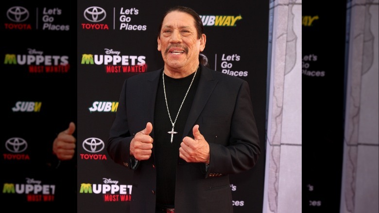Danny Trejo holding two thumbs up