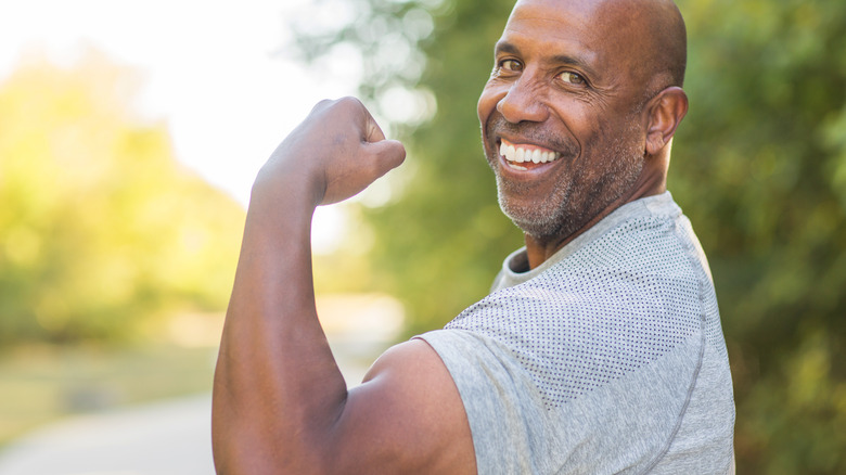 Man flexing his guns