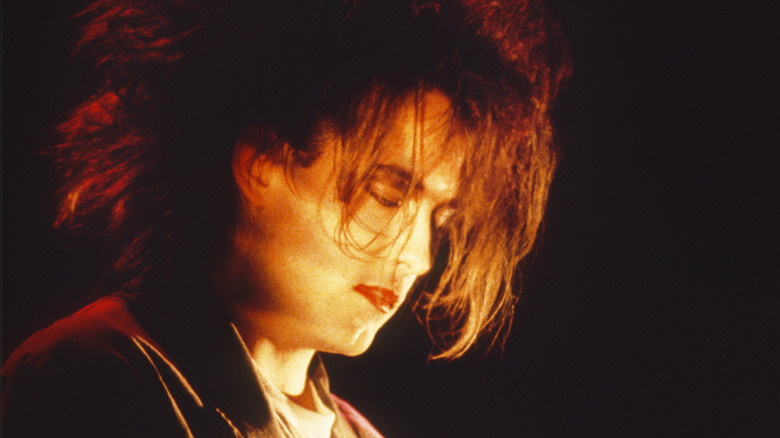 Robert Smith performing on stage