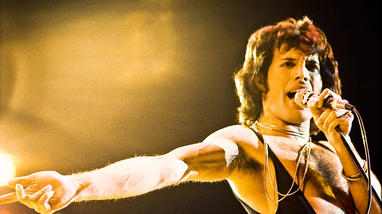 Freddie Mercury with microphone lightning shirt