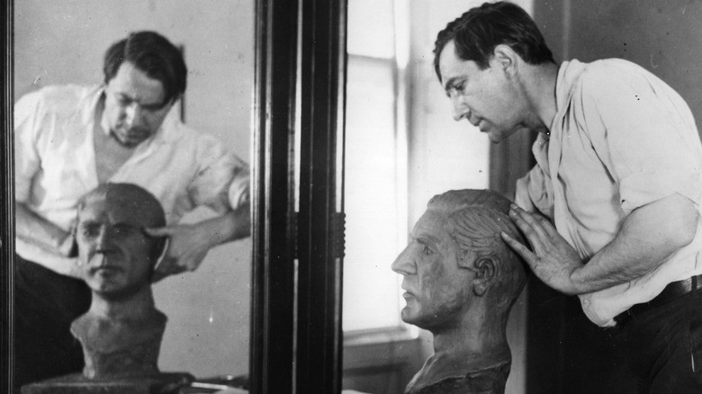 Bela Lugosi sculpting a self-portrait