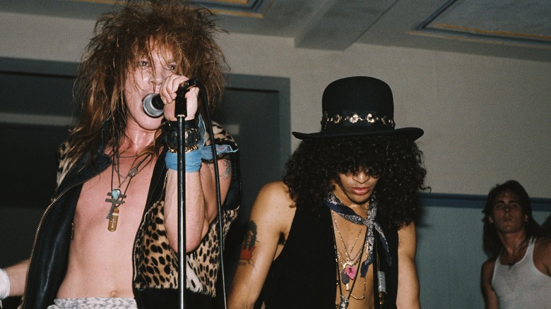 Axl Rose and Slash performing