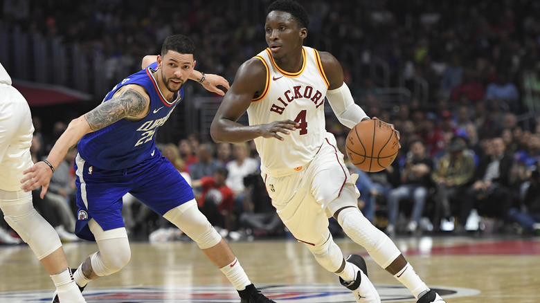 Victor Oladipo drives against Austin Rivers