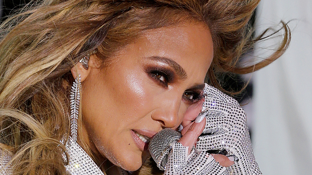 Jennifer Lopez singing into mic