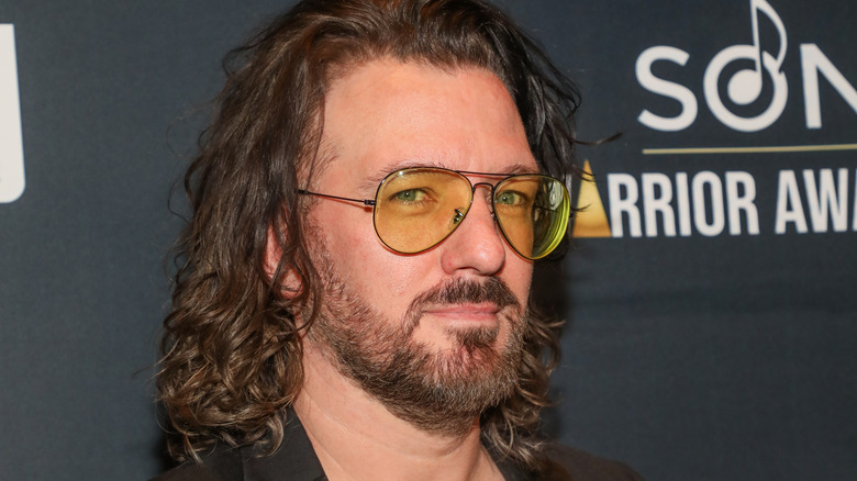 JC Chasez black suit yellow aviators