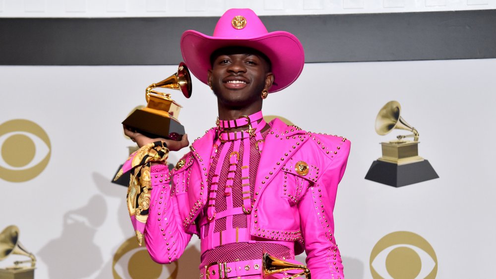 A photograph of Lil Nas X in a pink cowboy uniform from the 2019 Grammys.