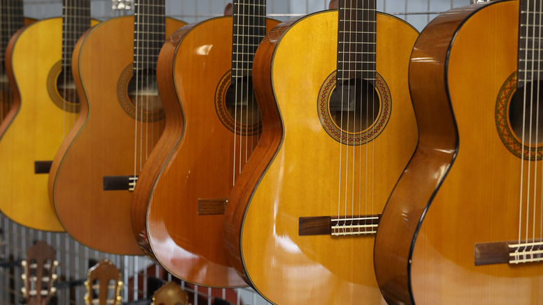 acoustic guitars hanging in store