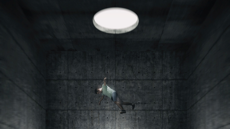 Falling into a large concrete room