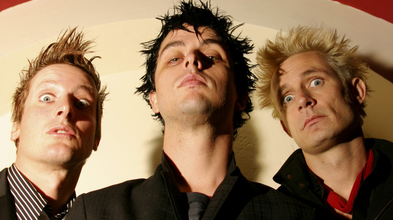 Green Day looking down at camera