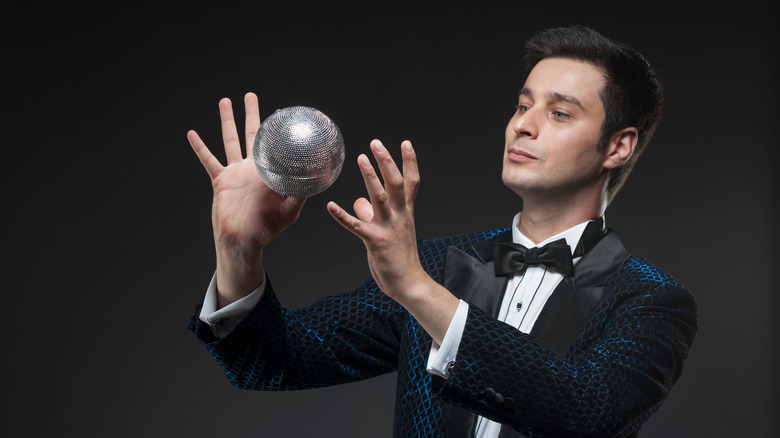 magician holding a ball