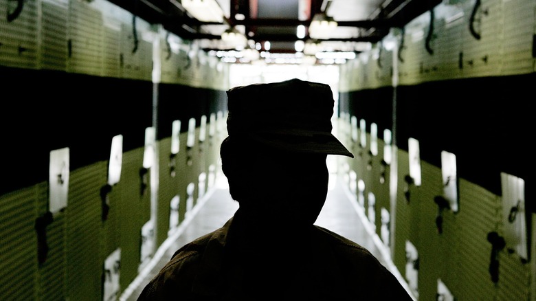 Guantánamo Bay guard walking hallway