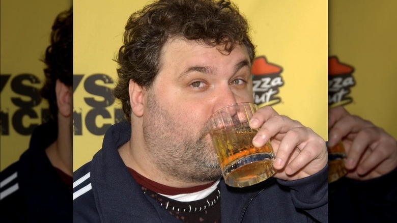 Artie Lange drinking a cocktail