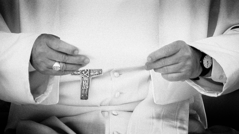 Pope Francis hands resting on lap