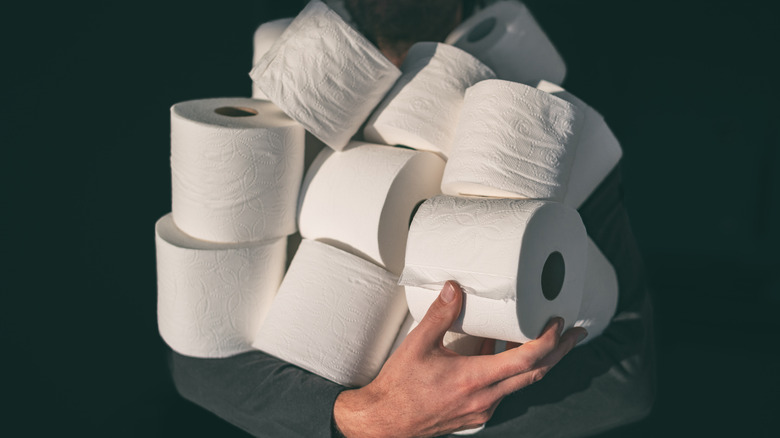 man holding toilet paper