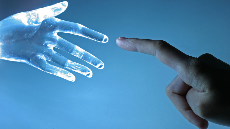 Human hand and virtual hand