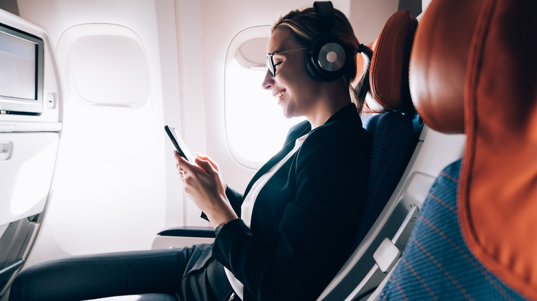 flying with headphones on a plane