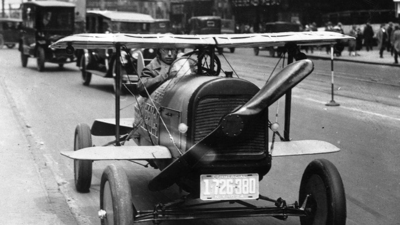 A flying car driving on the street